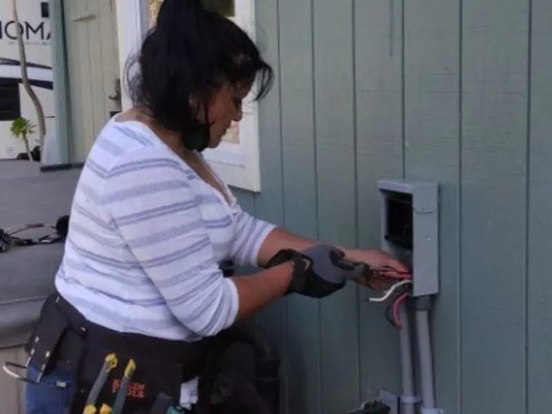 Licensed electrician wiring an exterior subpanel in Towamensing