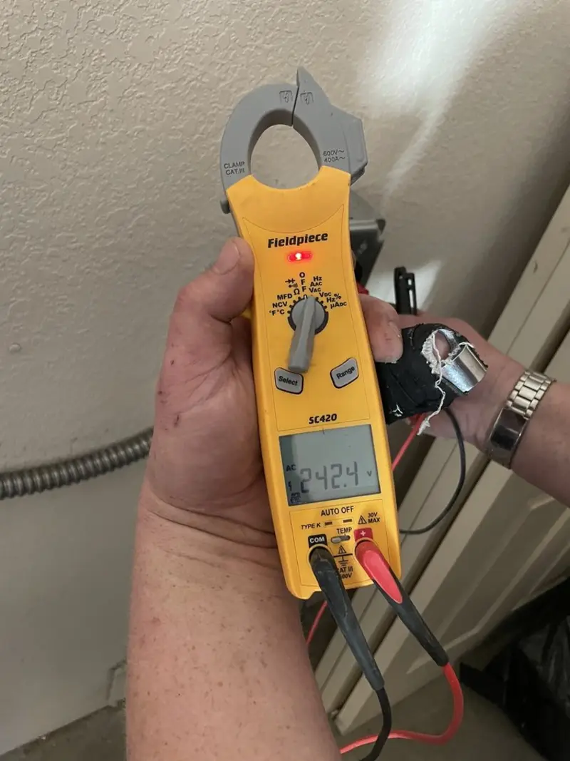 Voltage testing with clamp meter during Outlet Installation in Towamensing